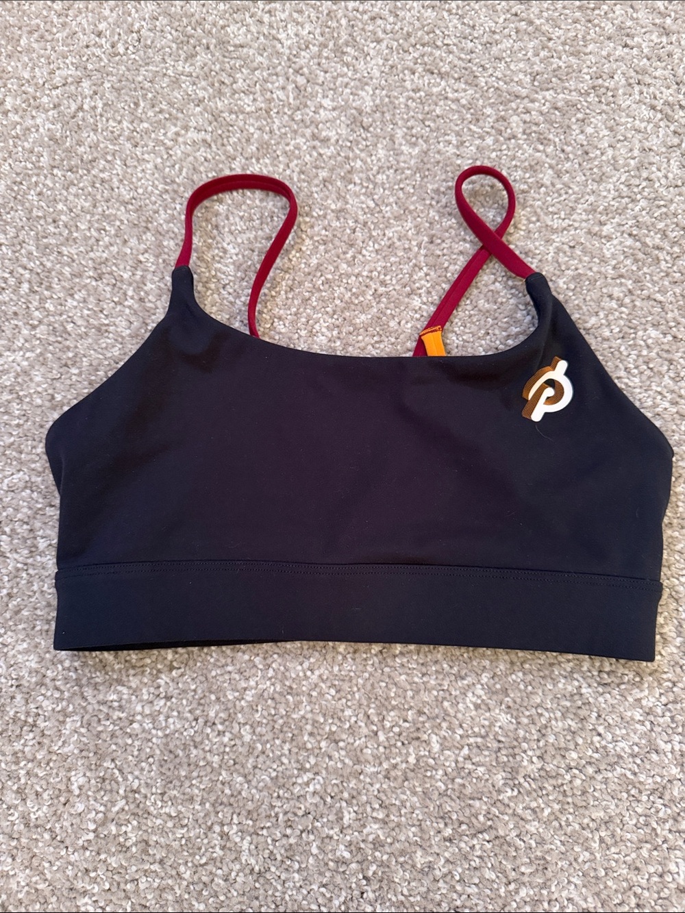 Peloton Black Sports Bra with Burgundy Straps and Gold Logo Accent